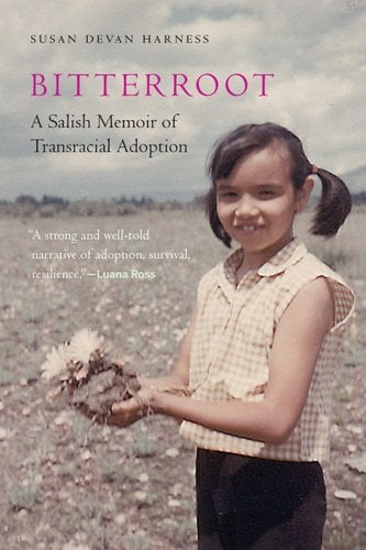 Bitterroot by Susan Devan Harness. There is an old photograph of a little girl in pigtails standing in a field and holding up a flower embedded in the soil while she smiles at the camera.