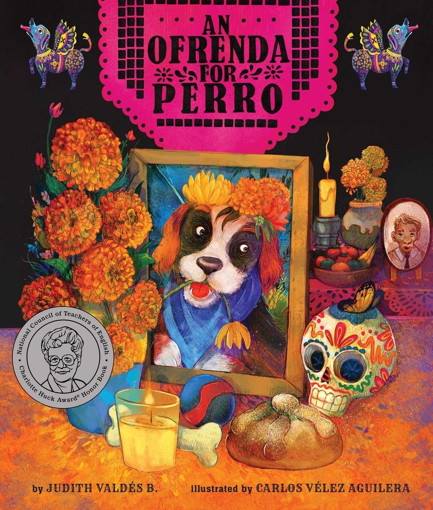Book cover of An Ofrenda for Perro by Judith Valdés B., Illustrated by Carlos Vélez Aguilera, featuring a framed photo of a black, brown and white dog surrounded by marigolds, candles, a sugar skull, and dog toys.