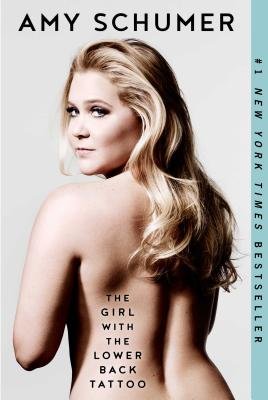 The Girl with the Lower Back Tattoo cover by Amy Schumer, Amy Schumer looking over her shoulder with the book title imprinted on her bare lower back.