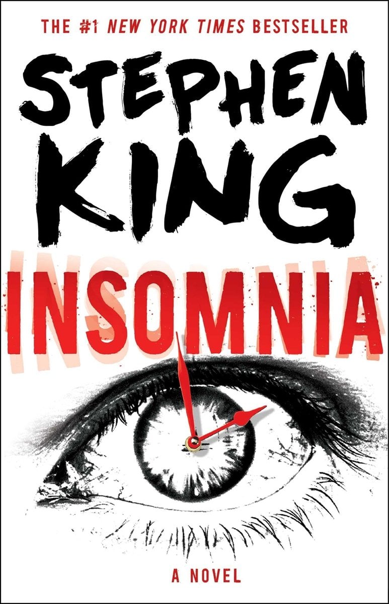 Insomnia by Stephen King. White Cover with the title having a blurred effect. Picture of an eye that is being used as the base of a clock with red hands.
