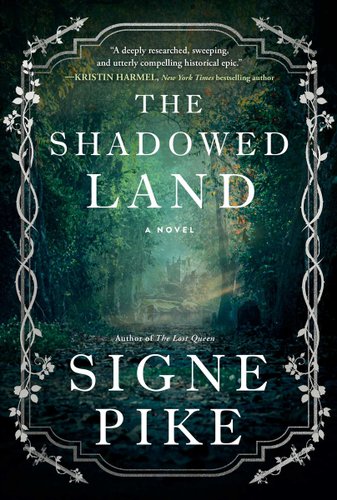 The Shadowed Land by Signe Pike book cover, a shady forest path dimly lit by sunlight filtering in through the green leaves of the tree canopy above.