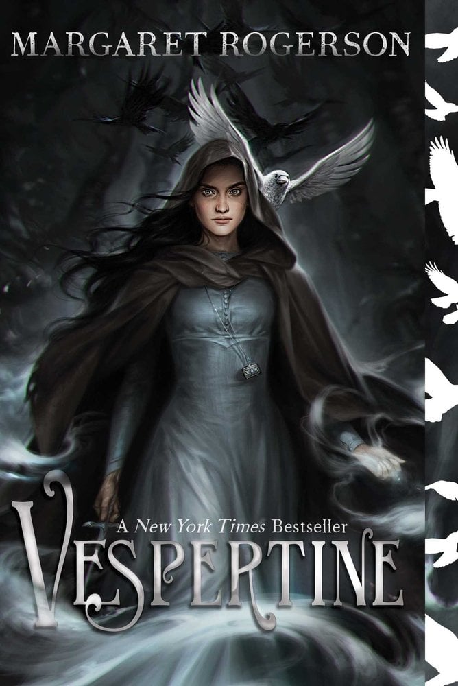 Cover of Vespertine by Margaret Rogerson. Grey and black background, with a girl in a dress and a cloak is in the center. She has her hood up and is holding a knife and there is a white bird behind her shoulder.