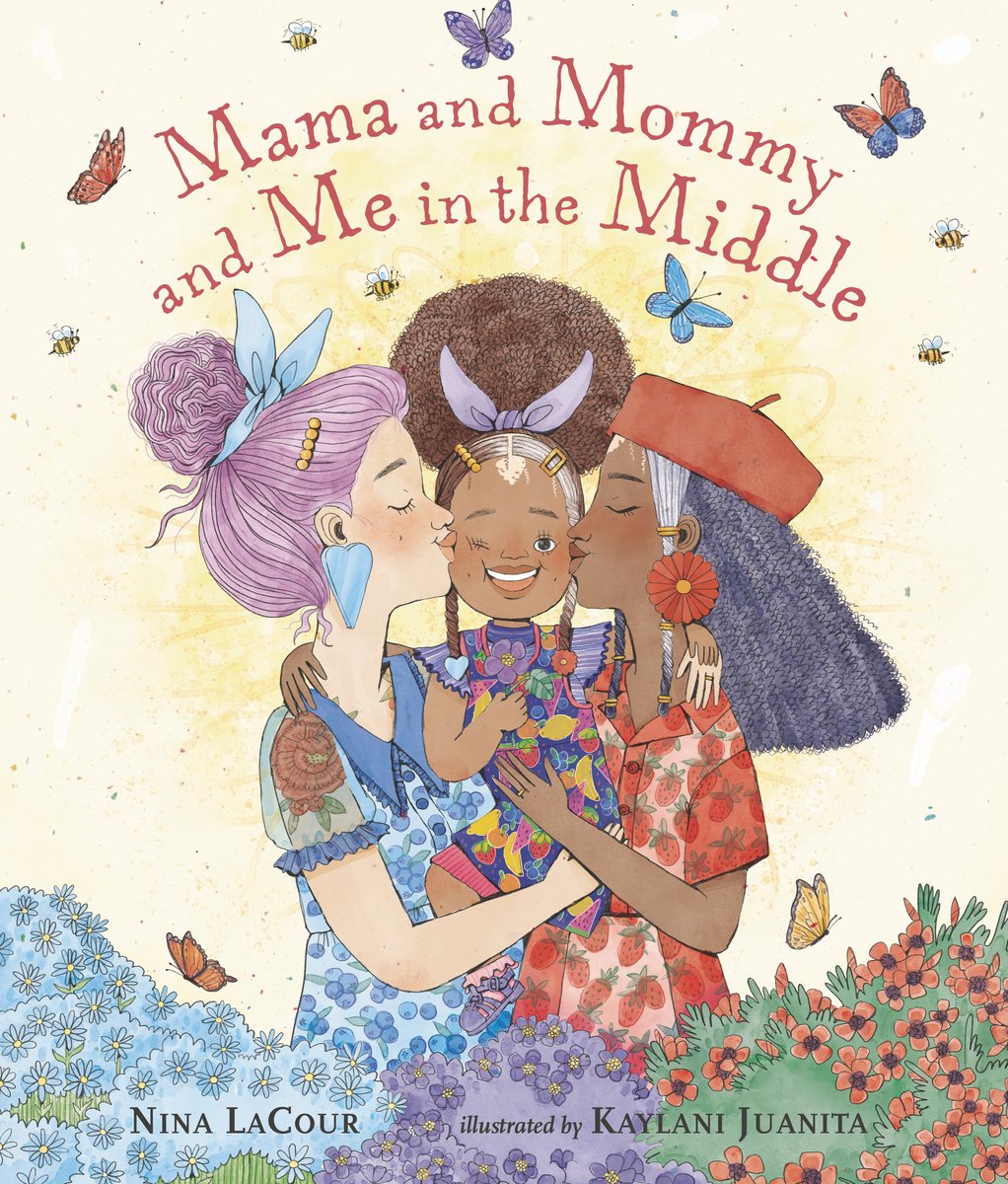 Book cover of Mama and Mommy and Me in the Middle by Nina LaCour, Illustrated by Kaylani Juanita, featuring two women - one light-skinned with straight purple hair in a bun, the other brown-skinned with long, dark textured hair - kissing either cheek of a brown-skinned child with a vitiligo patch and an afro puff in a field of flowers.