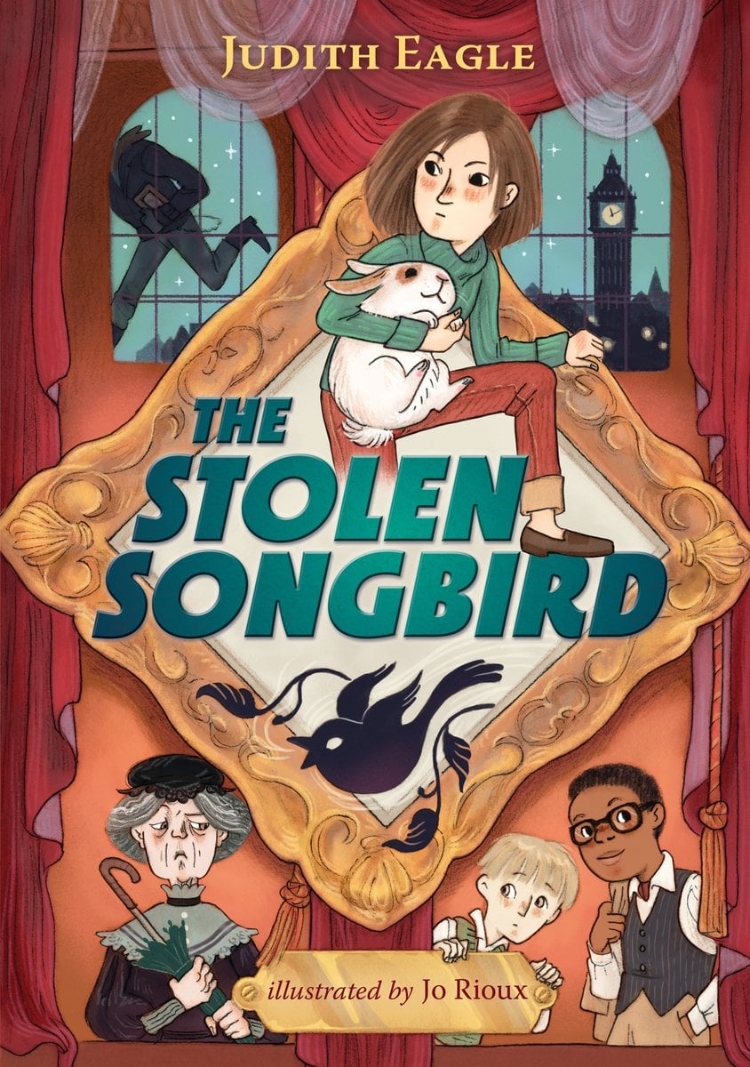 The Stolen Songbird by Judith Eagle book cover features a young girl with short brown hair and a serious, somewhat cautious expression sits atop an ornate gold picture-frame shaped like a diamond. Clutched in her arms is a white rabbit, which adds an intriguing mix of innocence and intrigue. Behind them, the backdrop is a red theater curtain and two tall windows: one reveals the silhouette of a figure sneaking away, while the other shows the iconic clock tower of London (suggesting the scene is set in that city). Below the main image, the title The Stolen Songbird appears in bold teal letters, and a black silhouette of a bird in mid-flight is depicted within the frame’s lower portion, reinforcing the notion of something valuable having been taken. Surrounding the frame are three additional characters at the bottom edge: an older woman with a stern face and umbrella, a young blonde boy peeking up anxiously, and a bespectacled young man in vest and tie looking inquisitive. The overall color palette leans warm (reds, golds, browns) but is pierced by cooler teals and pale greens which draw the eye to key elements.