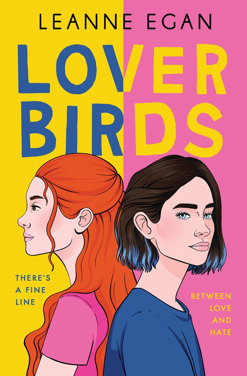The book cover for Lover Birds by Leon Egan. The background is split down the middle with yellow on the left and pink on the right. The left side has blue text and the right side has yellow text. In the center, two teen girls with pale skin stand back to back. On the left is a girl with long red hair, brown eyes, and a pink t-shirt. On the right is a girl with short dark brown hair with blue tips, blue eyes, and a dark blue t-shirt.