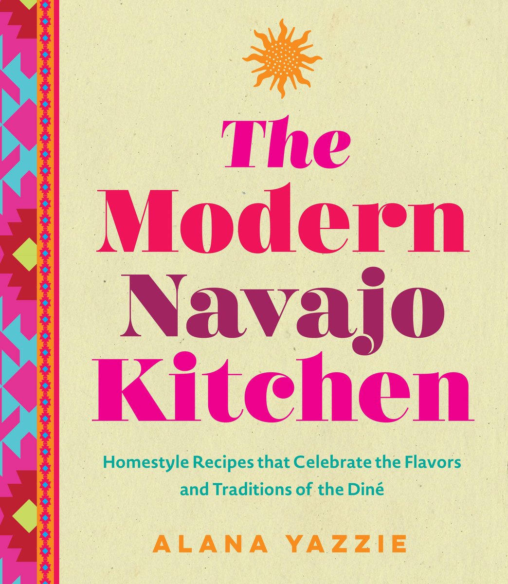 The Modern Navajo Kitchen by Alana Yazzie, an Indigenous cookbook focusing on Navajo cuisine, cover of large title text with each word a varying shade of pink. The spine and left of the cover is bordered with a blue, dark red, yellow, pink, and orange Indigenous pattern. There is an illustrated yellow sun over the title text.