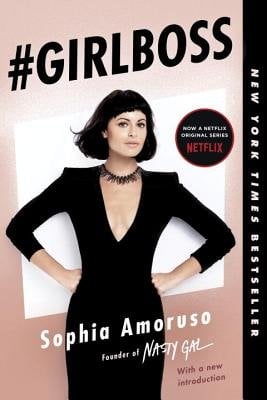 Book cover of #Girlboss with Sophia Amoruso standing with her hands on her hips staring forward on a white square and pinkish background.