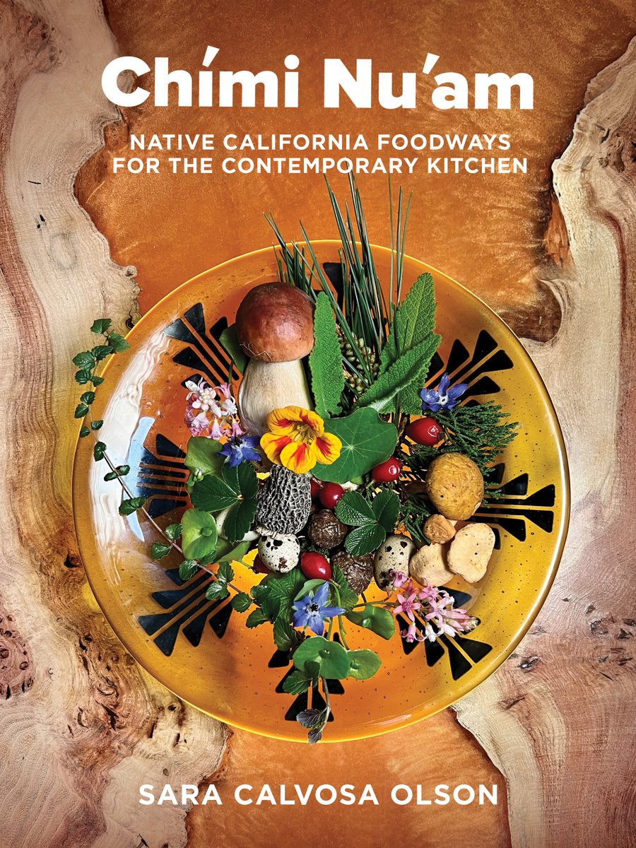 Chími Nu'am by Sara Calvosa Olson, an Indigenous cookbook on Californian Indigenous dishes, cover of a patterned yellow plate holding spotted eggs, wild flowers, mushrooms, and herbs on a rough wooden table.