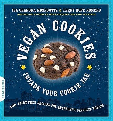 Vegan Cookies Invade Your Cookie Jar: 100 Dairy-Free Recipes for Everyone’s Favorite Treats by Isa Chandra Moskowitz and Terry Hope Romero book cover featuring a chocolate cookie with white chocolate chips and almonds.