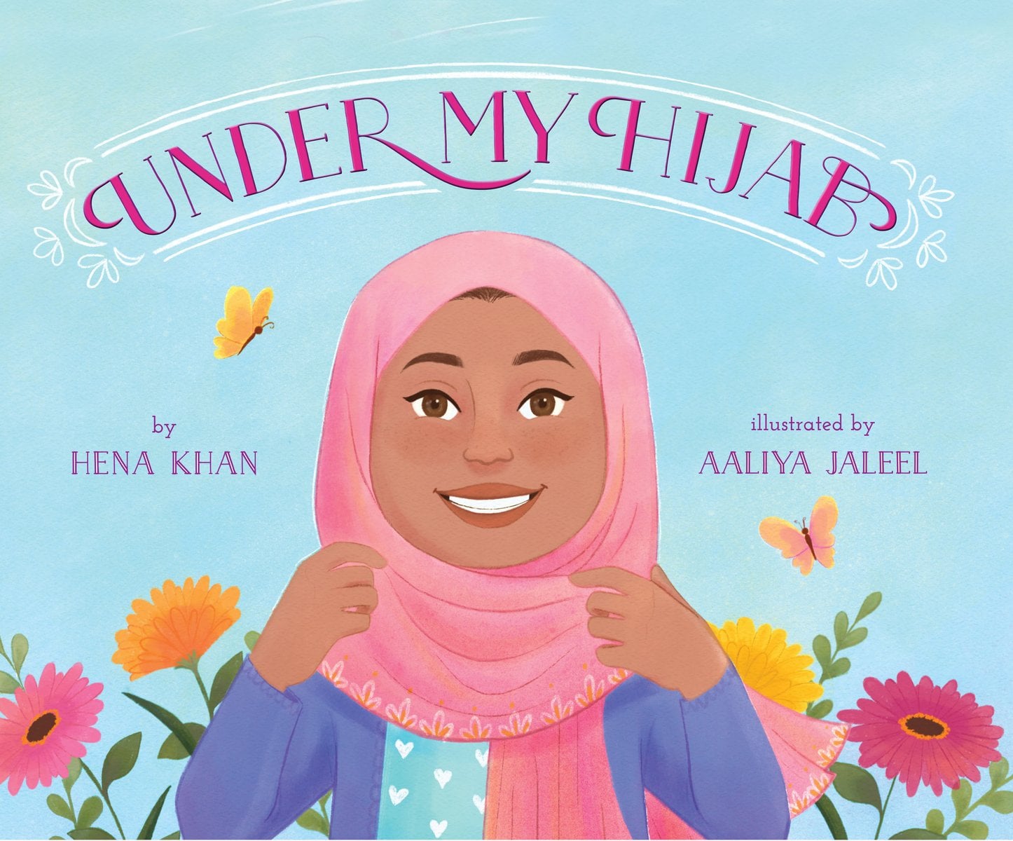 The book cover of Under My Hijab by Hena Khan, Illustrated by Manal Mirza, features a smiling brown-skinned girl wearing a light pink hijab; behind her are flowers and butterflies.