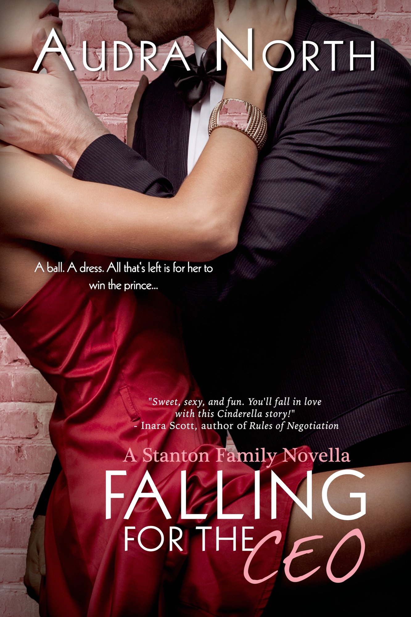Falling for the CEO by Audra North,a romance book cover depicting a woman wearing a short red dress embracing a man in a black suit in front of a brick wall.