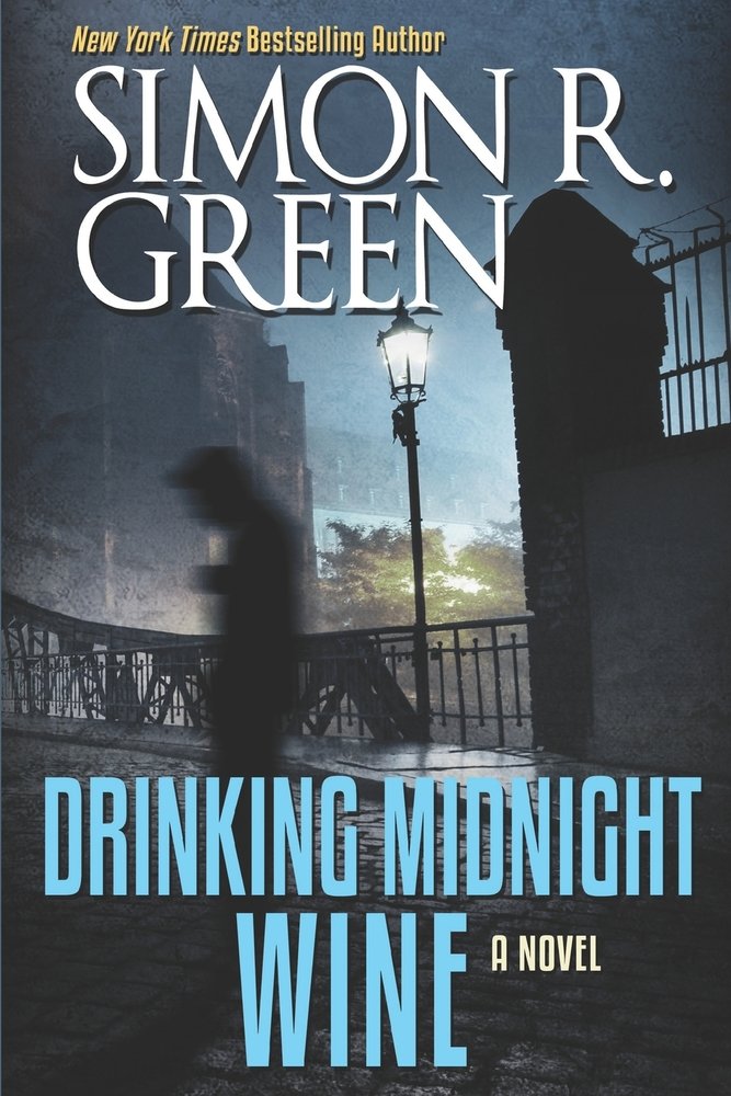 Drinking the Midnight Wine by Simon R. Green, a fantasy book cover depicting nighttime in a city on a bridge. There is a blurry figure walking. The title is printed in a bold blue font.