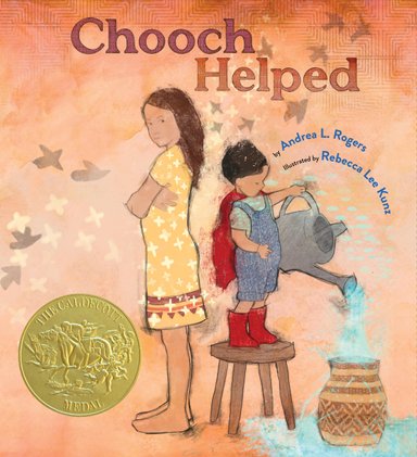 Book cover of Chooch Helped, Illustrated by Rebecca Lee Kunz, Written by Andrea L. Rogers, featuring two tan-skinned children, one older with long straight brown hair and the other younger with short dark hair and wearing a red cape; the younger child is pouring water from a watering can into a jug.