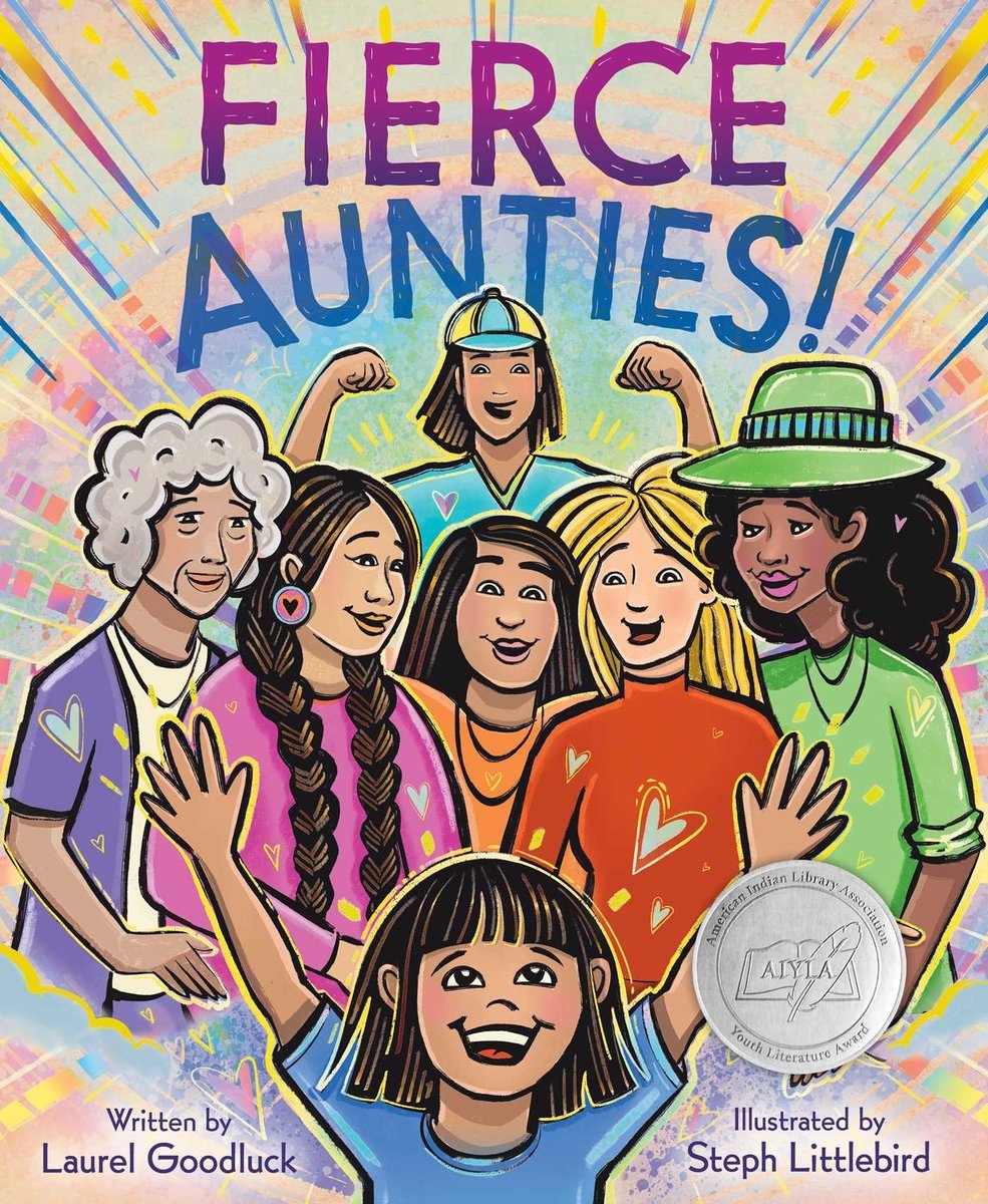 Book cover of Fierce Aunties! by Laurel Goodluck, Illustrated by Steph Littlebird, featuring a tan-skinned child with straight, chin-length dark hair raising their arms and smiling; surrounding them are six women diverse in skin tone, hair color/texture, and age.