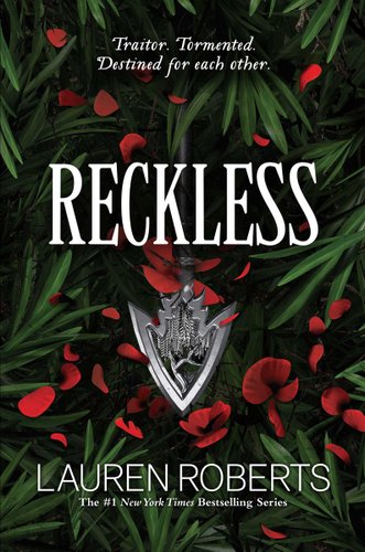 A silver arrow head sits atop green leaves and red flower petals.