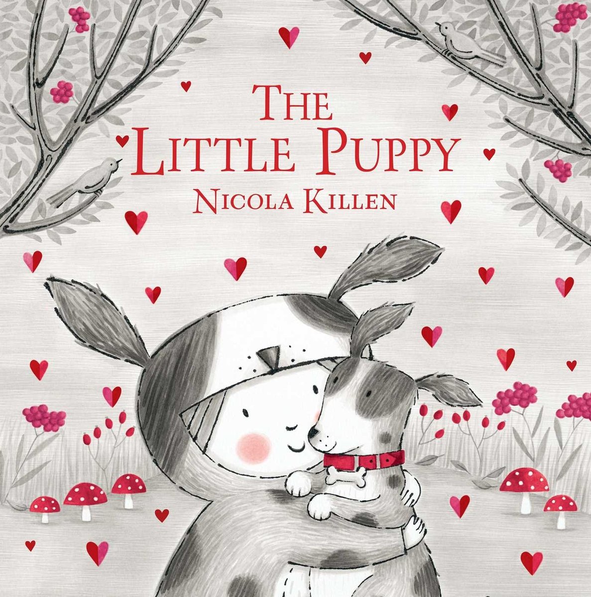 Book cover of Little Puppy by Nicola Killen, featuring a light-skinned child in a dog costume hugging a spotted puppy in a wooded area.