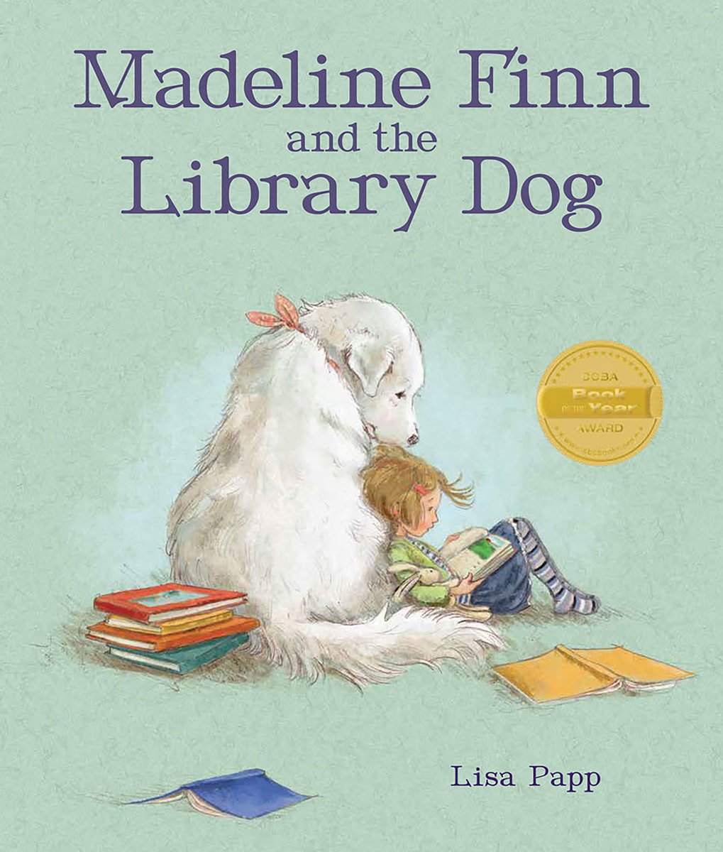 Book cover of Madeline Finn and the Library Dog by Lisa Papp, featuring a light-skinned child with short, straight blonde hair reading a book as she reclines against a large, fluffy white dog.