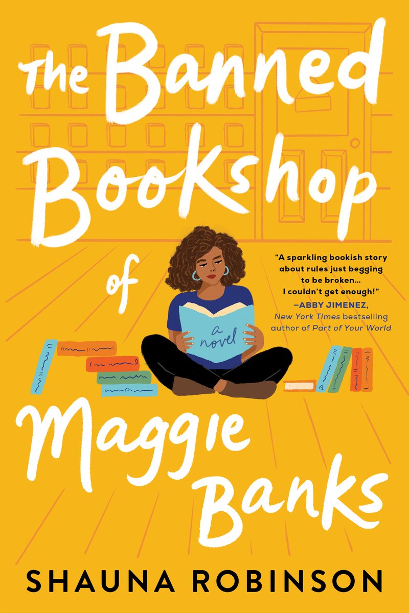Cover of "The Banned Bookshop of Maggie Banks" by Shauna Robinson, with a woman sitting in the middle reading a book. The background is an all yellow room with colorful books to the left and right of the woman.