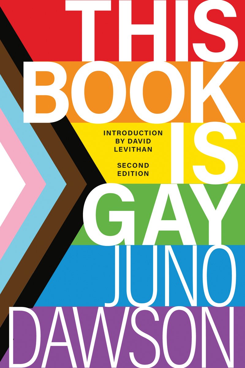 This Book Is Gay by Juno Dawson, a nonfiction book cover. The LGBTQ+ flag with "This" in the red stripe, "Book" in the orange, "is" in the yellow, "Gay" in the green, "Juno" in the blue, and "Dawson" in the blue.