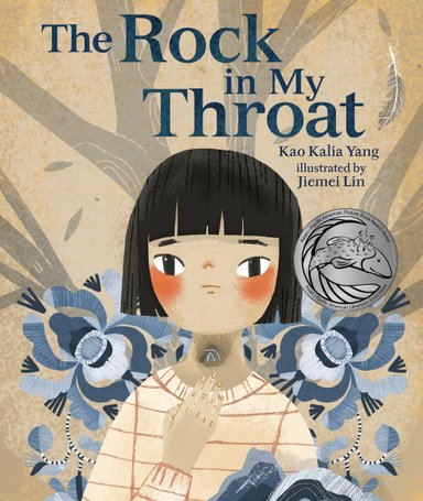 Book cover of The Rock in My Throat by Kao Kalia Yang, Illustrated by Jiemei Lin, featuring a light-skinned child with short straight black hair looking concerned and raising a hand to their throat, where a small stone is visible within.