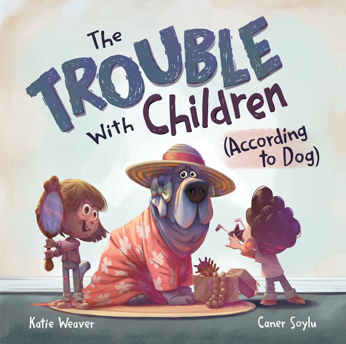 Book cover for The Trouble With Children (According to Dog) by Katie Weaver, illustrated by Caner Solyu. Every word in the title is in black text except "trouble" which is in blue hand colored text. "According to dog" is also highlighted in a pale orange color. In the middle of the cover, a gray and white dog wears a sun hat with an orange ribbon, an orange shirt patterned with white flowers and a panicked expression. Two children, a boy with brown, curly hair and a girl with brown hair holding a mirror are looking at the dog.