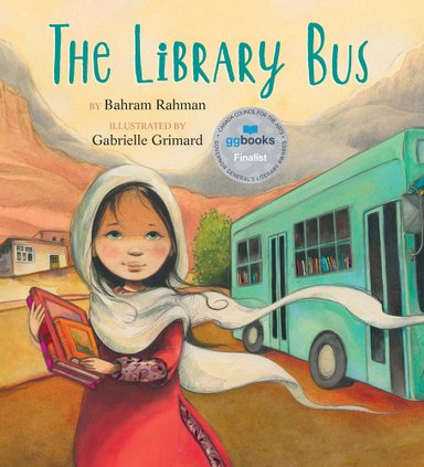 Book cover of The Library Bus by Bahram Rahman, Illustrated by Gabrielle Grimard, featuring a smiling tan-skinned girl with dark, straight head and wearing a white head covering holding a small stack of books while standing in front of a turquoise bus in a high desert terrain.
