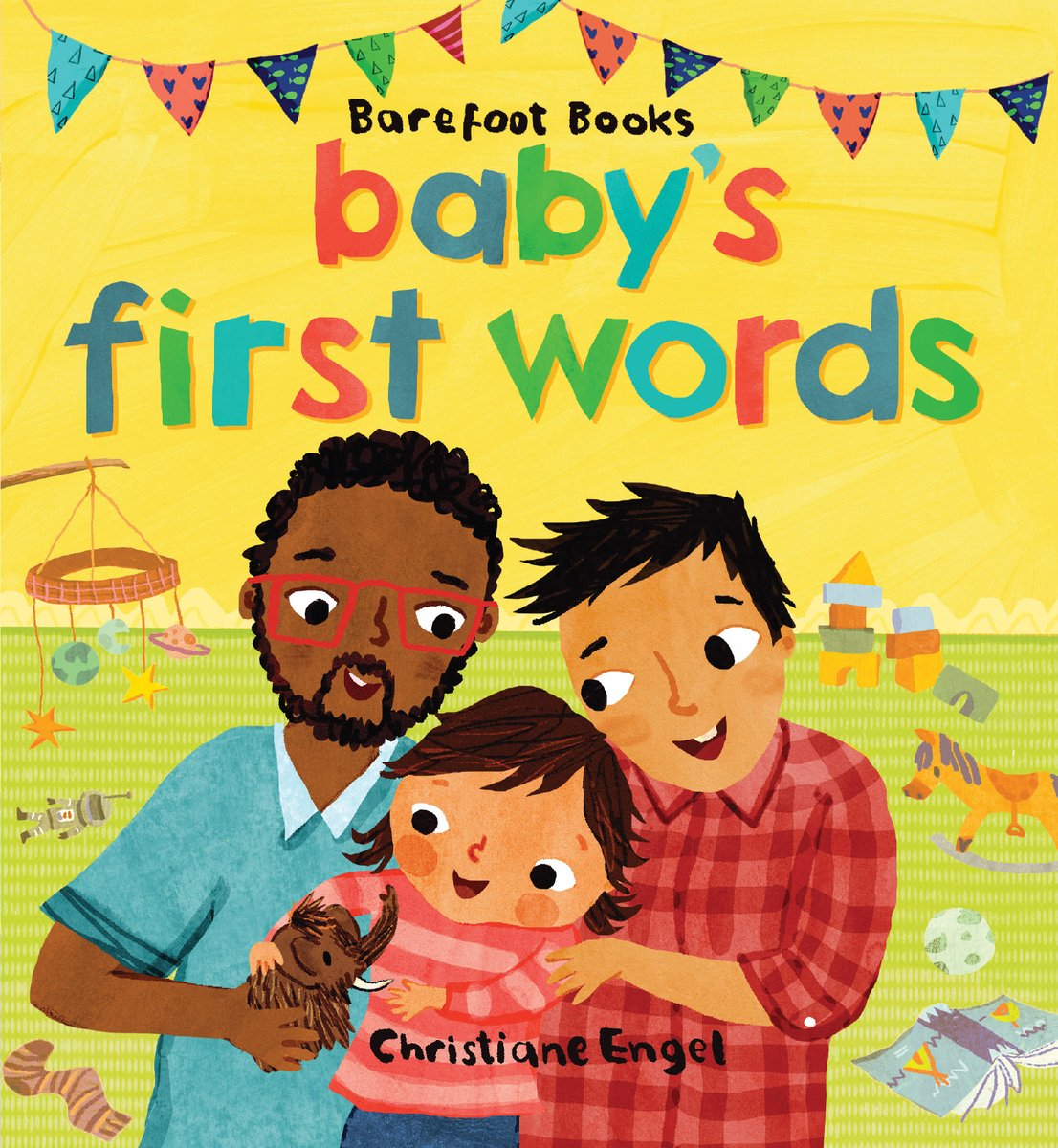 Book cover of Baby's First Words by Stella Blackstone & Sunny Scribens, Illustrated by Christiane Engel, featuring two adult men - one tan-skinned with short, straight dark hair and one brown-skinned with short, curly dark hair and beard - playing with a tan-skinned child with short, straight brown hair in a child's playroom.