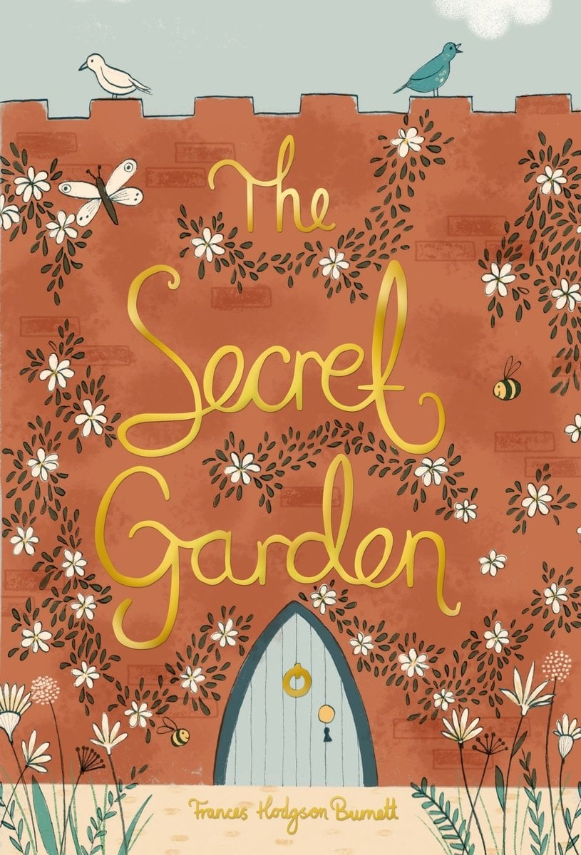 The book cover for The Secret Garden by Frances Hodgson Burnett. A warm brown brick wall with white flowers growing on it. In the bottom center is a blue door. The title is over the top of the wall in gold cursive text.