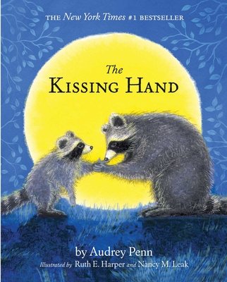 Two racoons--one small and one big-- stand on the grass in front of a yellow moon. The large racoon is holding the hand of the small racoon. The title sits against the yellow moon. The author's name is at the bottom in white lettering. Everything is set against a blue background with leaves bordering the left and right sides.