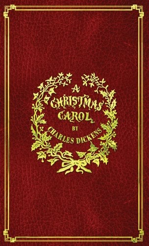A Christmas Carol book cover with a red leather cover with gold embossing.