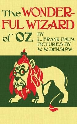 The Wonderful Wizard of Oz by L. Frank Baum and Pictures by W. W. Denslow. Yellow background with tip half with title and the bottom half with a cartoonish lion with glasses looking back.