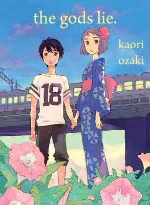 The Gods Lie by Kaori Ozaki. A Japanese manga cover, two illustrated young teens hold hands in front of pink flowers, with a train in the background.