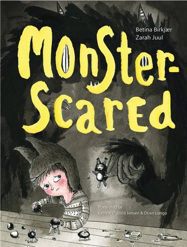 Black and grey book cover for Monster Scared by Betina Birkjær, with yellow letters and an illustration of a child playing with toys and a shadowy monster behind them.