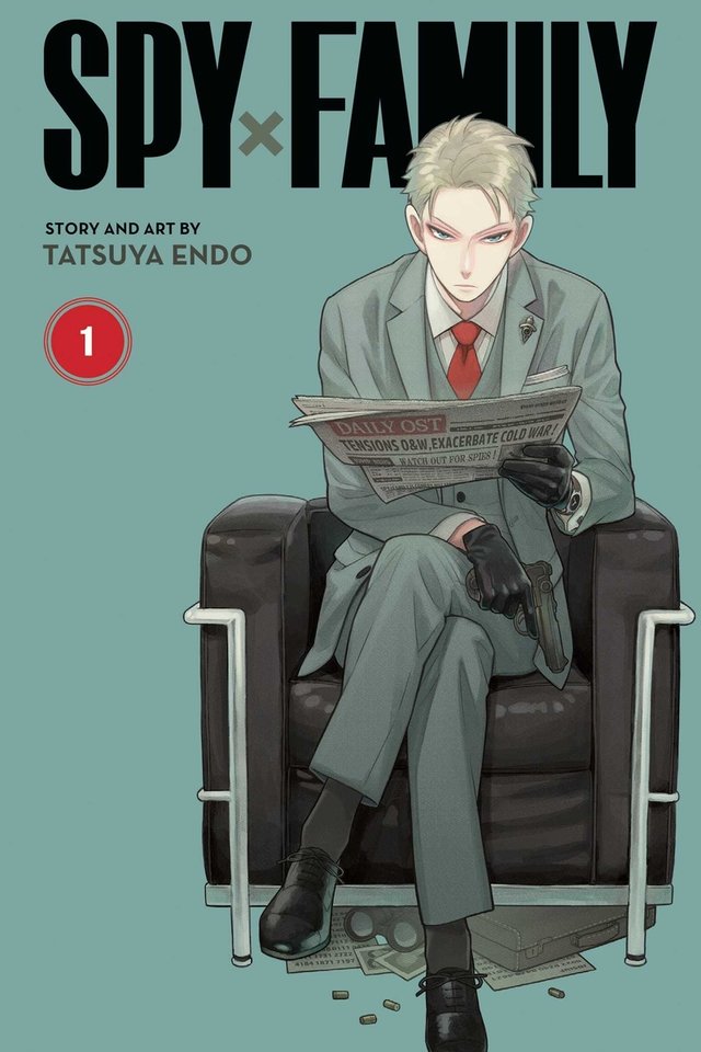 Spy x Family by Tatsuya Endo, book cover. Blue background with a blonde man in a blue tuxedo sitting on a black armchair. He is reading a newspaper and holding a pistol while gazing at the viewer.