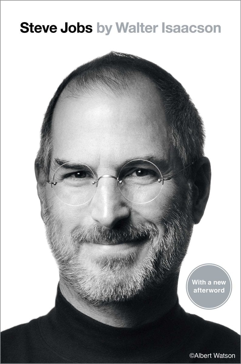 Steve Jobs, a biography by Walter Isaacson. The cover is a large black and white headshot of Steve Jobs.