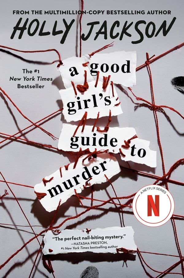 A Good Girl’s Guide to Murder by Holly Jackson, book cover. A solid white background with red strings filtered throughout the cover, similar to a murder mystery map. In the center are pieces of paper that display the title.