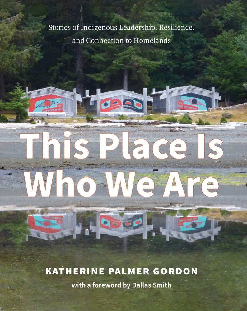 This Place Is Who We Are by Katherine Palmer Gordon book cover depicting three buildings with cultural paintings reflected on a body of water at the edge of a forest.