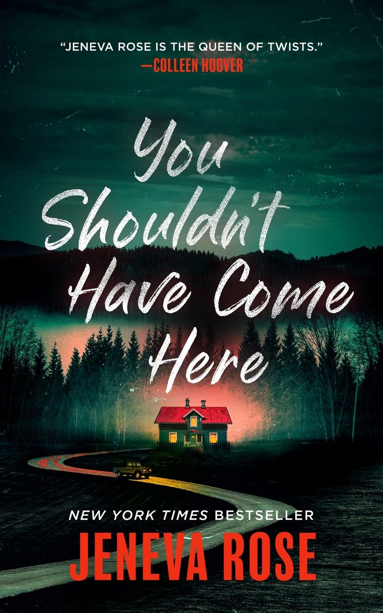 You Shouldn't Have Come Here by Jeneva Rose book cover featuring a small cabin with a forest and mountains in the background with a long winding road leading up to it.