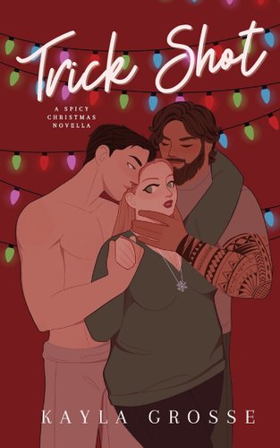 A woman with red hair, a green sweater, and black pants is held by tow men. On the right is a shirtless man with short dark brown hair and gray pants. On the right is a man with lighter brown hair, a beard, a gray shirt, and has a tattoo sleeve.