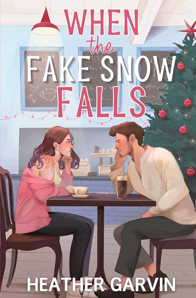When the Fake Snow Falls by Heather Garvin, a holiday romance book cover depicting an illustration of a man and woman sitting at a dining table with a Christmas tree and decoration in a blue scheme kitchen.